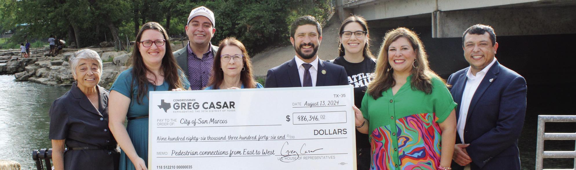 City receives million dollar check for east and west sidewalk connection